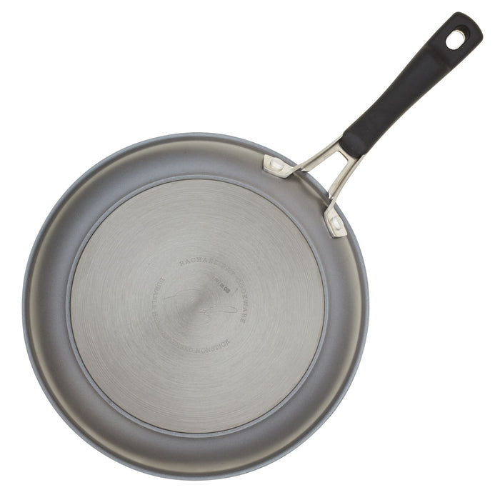 Top view of a Cook + Create Hard Anodized Nonstick Frying Pan, crafted from hard-anodized aluminum, featuring a triple-layer nonstick surface and a sleek black handle.