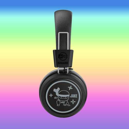 MEE audio KidJamz Share Bluetooth Wireless Headphones with a Ninja Turtle cartoon with the custom name "Jake" on the faceplate on a colorful background