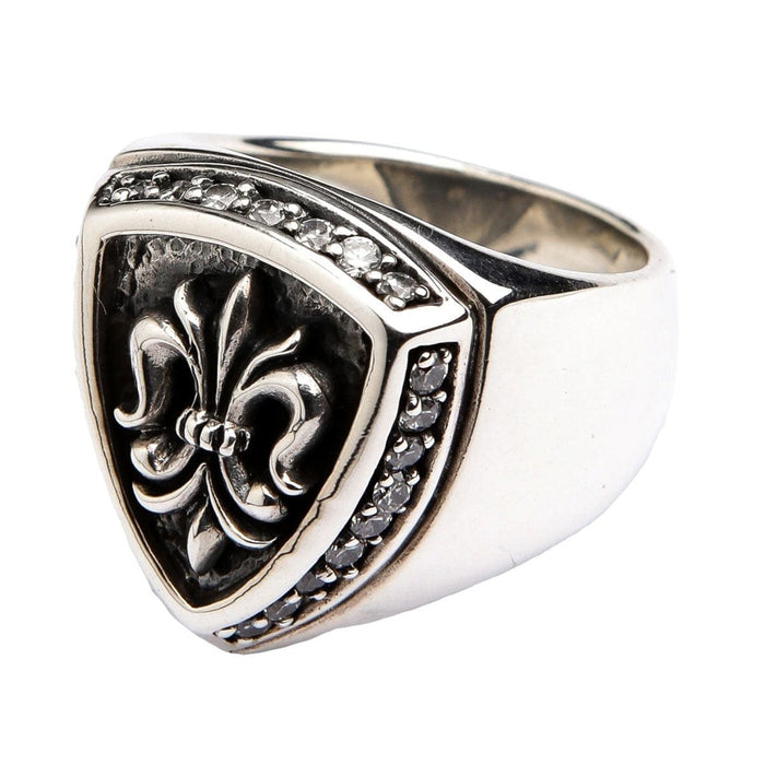 Side view of the men's silver shield ring, showing the thick band and channel-set stones.