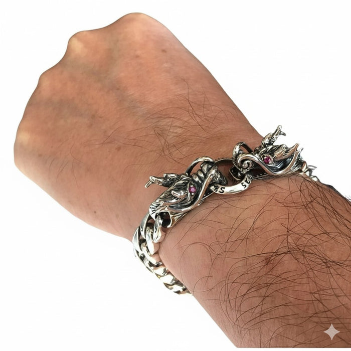 A man's wrist wearing the gothic silver dragon bracelet, showing its size and fit.