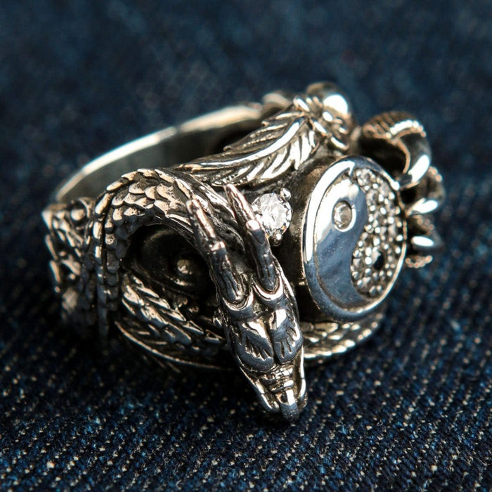 Detailed dragon head on sterling silver yin yang ring with scales