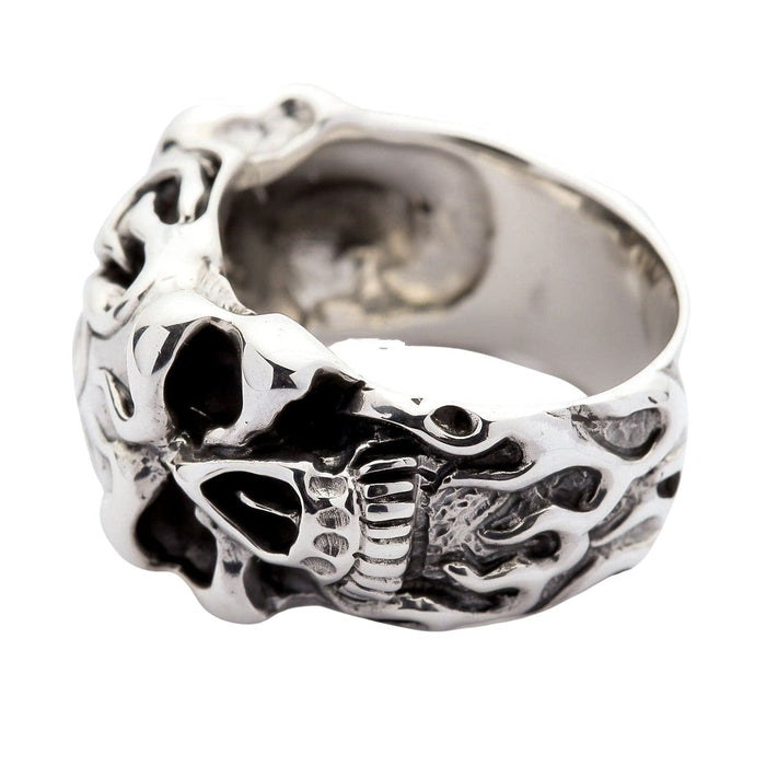 A solid sterling silver flame skull ring with intricate, tribal-style flames and a high-polish, high-contrast finish.