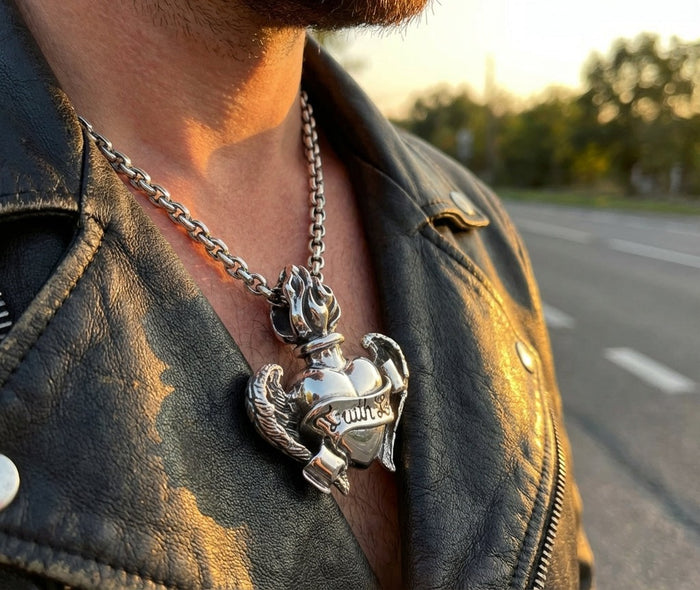Man wearing Gothic flaming heart wings pendant in 925 sterling silver with leather jacket