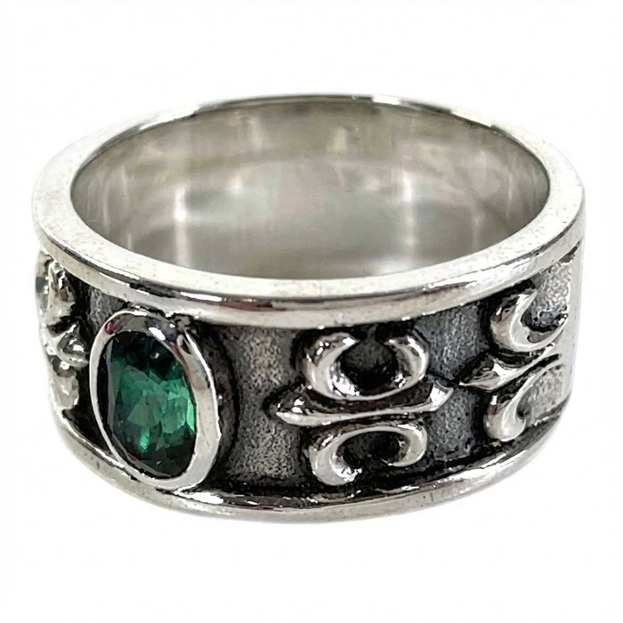 Angled view showing the oxidized finish and heraldic lily design