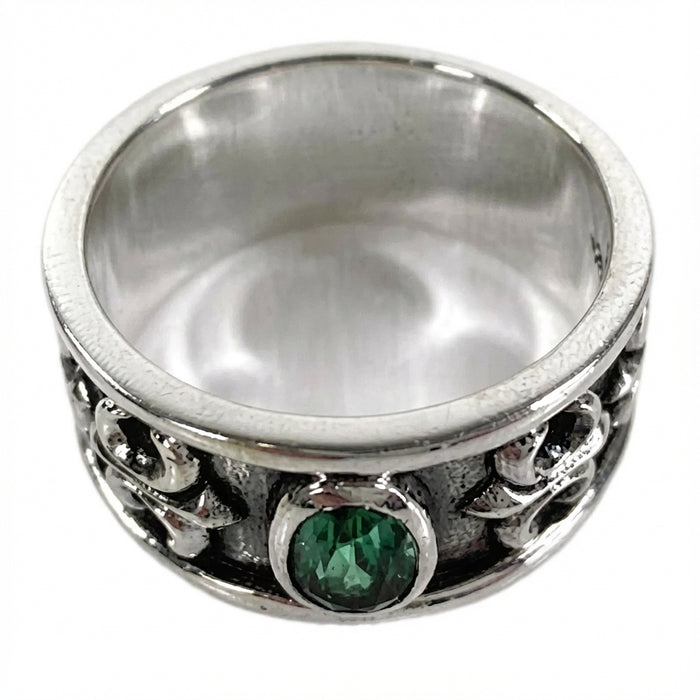 Top down view focusing on the emerald CZ cut and silver bezel