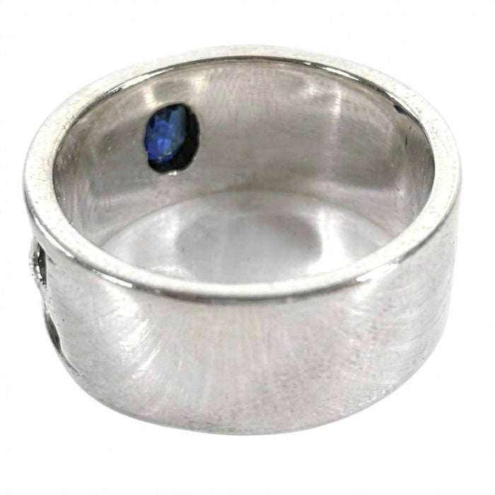 Smooth rear profile of the solid silver band, showing the polished interior and the back of the blue sapphire CZ stone.