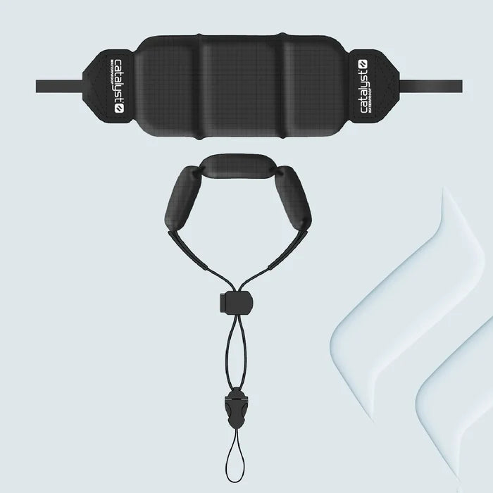 A Catalyst Case US Floating Lanyard in Stealth Black is shown from top and front views on a light grey background. It features adjustable, soft segmented padding, a secure clip and lanyard, and translucent white geometric accents.