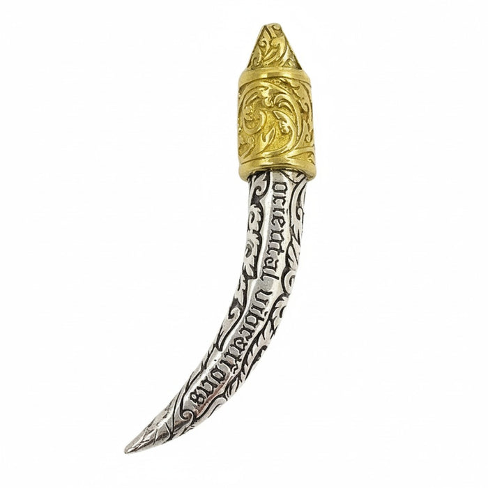The intricate oxidized carving on the sterling silver tusk pendant.