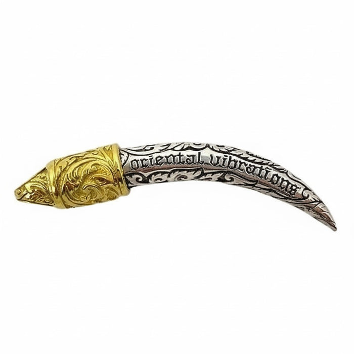 The side of the Ganesha tusk pendant showing the "Oriental vibrations" text carved into the silver.