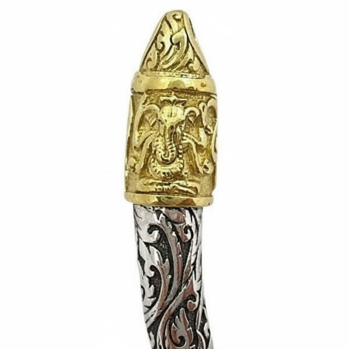 A close-up of the 14K gold-plated brass cap on the tusk pendant, showing the carved Ganesha.