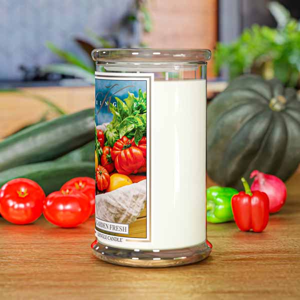 Clear jar candle labeled "Garden Fresh" with an image of assorted tomatoes and greens on the front.