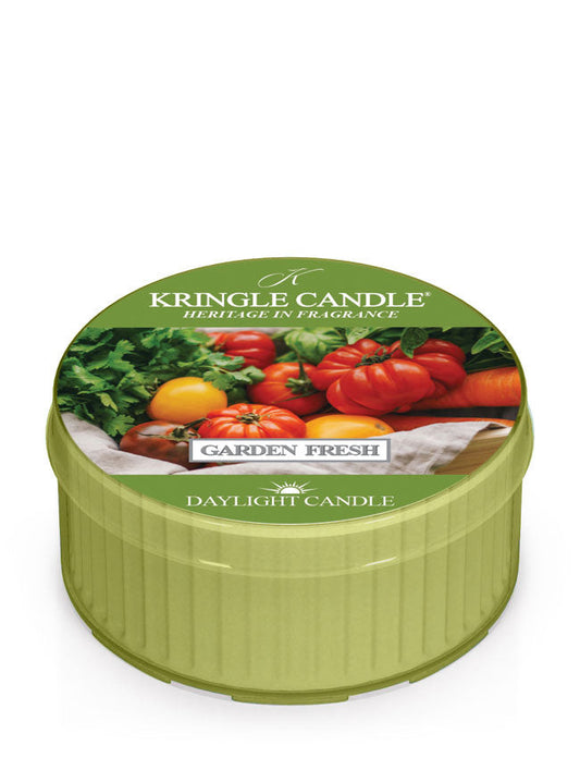 Green Kringle Candle tin labeled "Garden Fresh," featuring images of tomatoes and greens on the lid.
