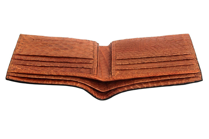 An angled view of the open artisan crocodile wallet, detailing the hand-stitched card slots.