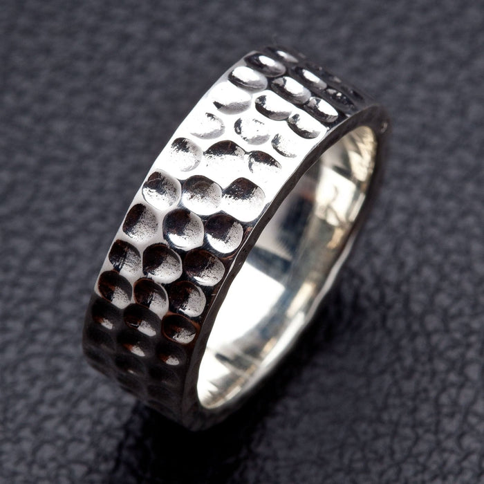 A premium, unisex sterling silver hammered band, a perfect choice for a stylish and rugged wedding ring.