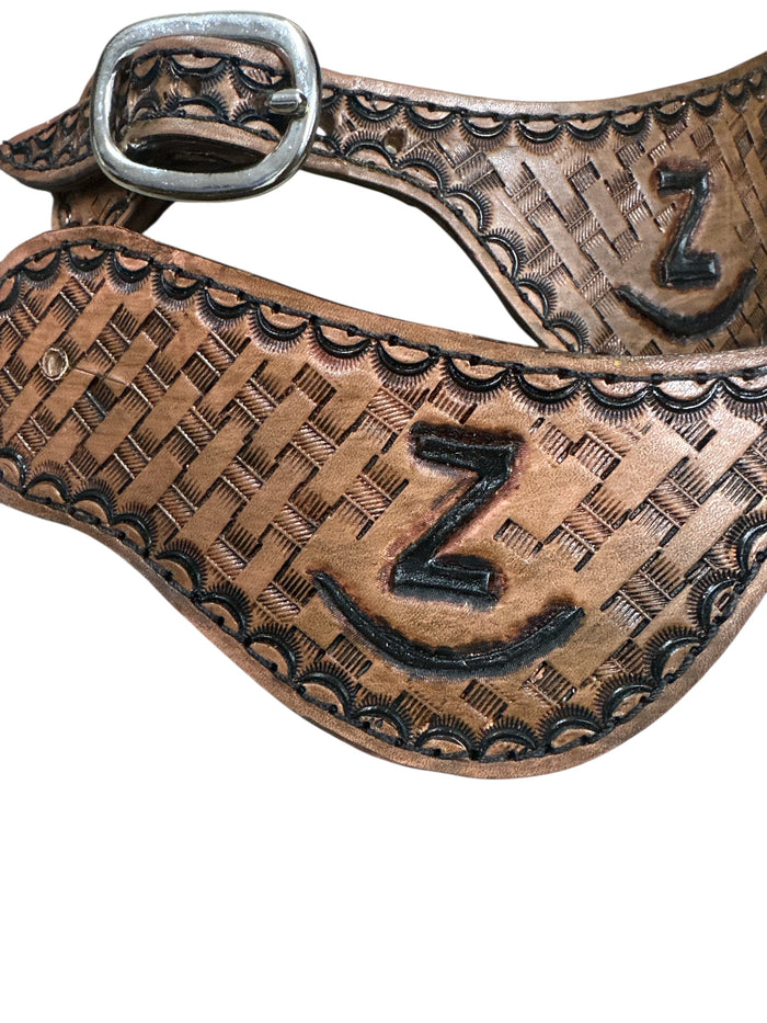 Hand tooled and painted Custom Brand spur straps basketweave.