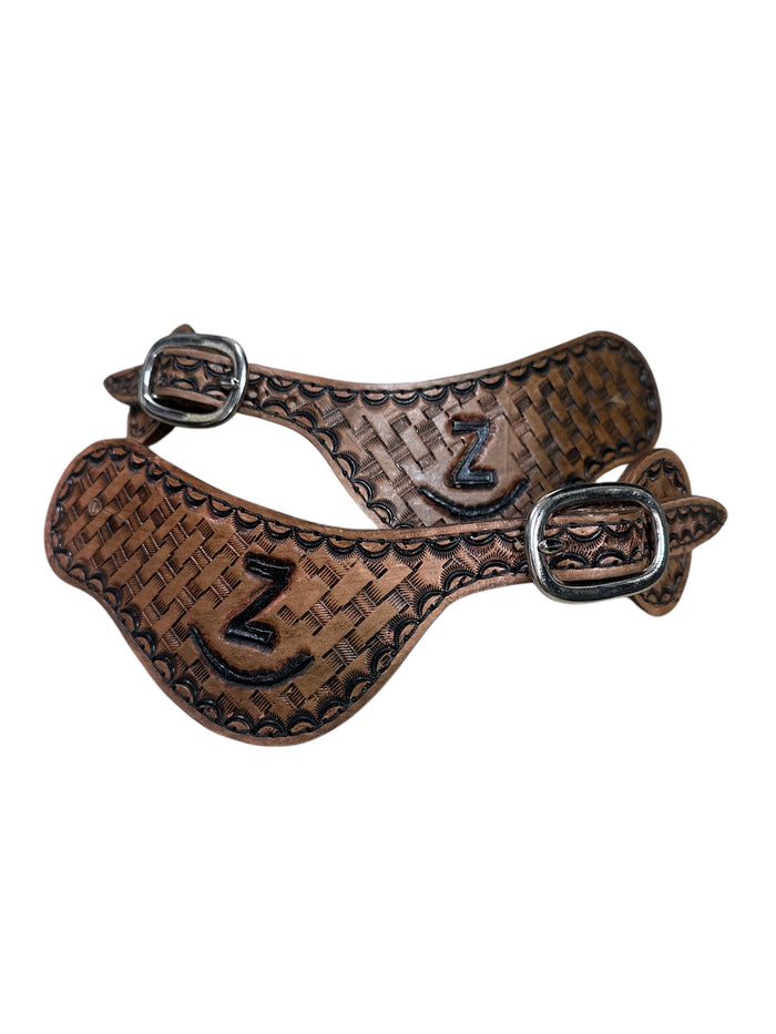 Hand tooled and painted Custom Brand spur straps basketweave.