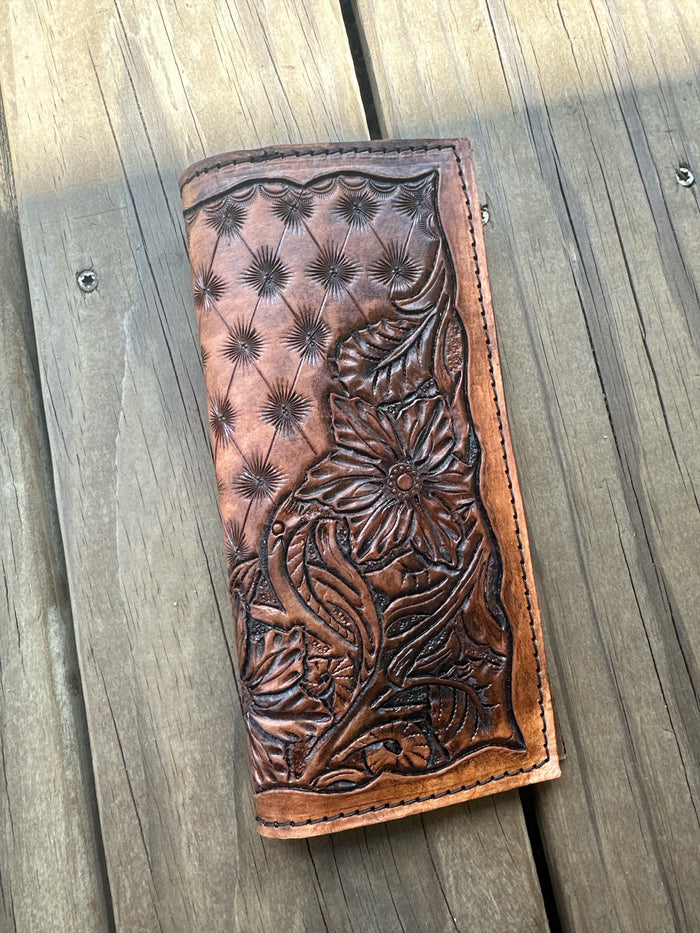 Hand tooled tally book.