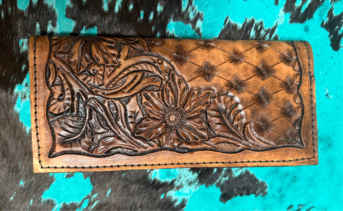 Hand tooled tally book.