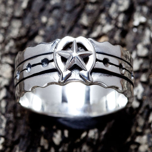 Front view of the 925 silver horseshoe star band ring showing the star motif.