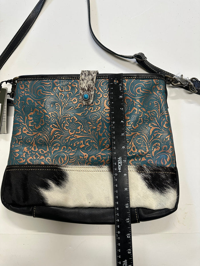Myra  turquoise and black cowhide leather hand bag with tooled leather.