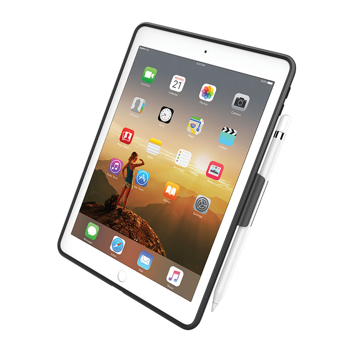 A white iPad (Gen 6/5), 9.7", in a black Catalyst Case US Impact Protection Case is propped up at an angle. The screen shows app icons and mountain wallpaper, with an Apple Pencil attached. Background is plain white.