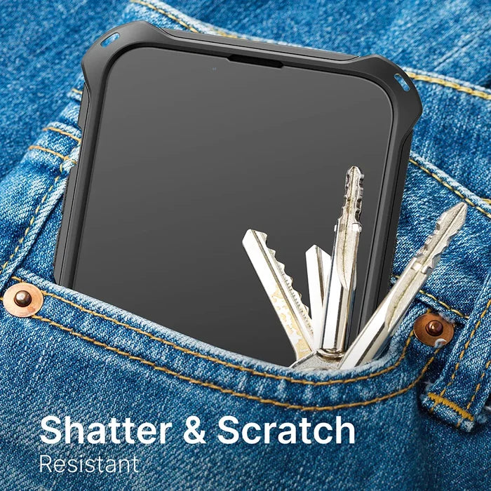 An iPhone 14 Pro with a Catalyst Case US Tempered Glass Screen Protector sits in a jeans pocket beside metal keys, its screen flawless. White text reads: "Shatter & Scratch Resistant.