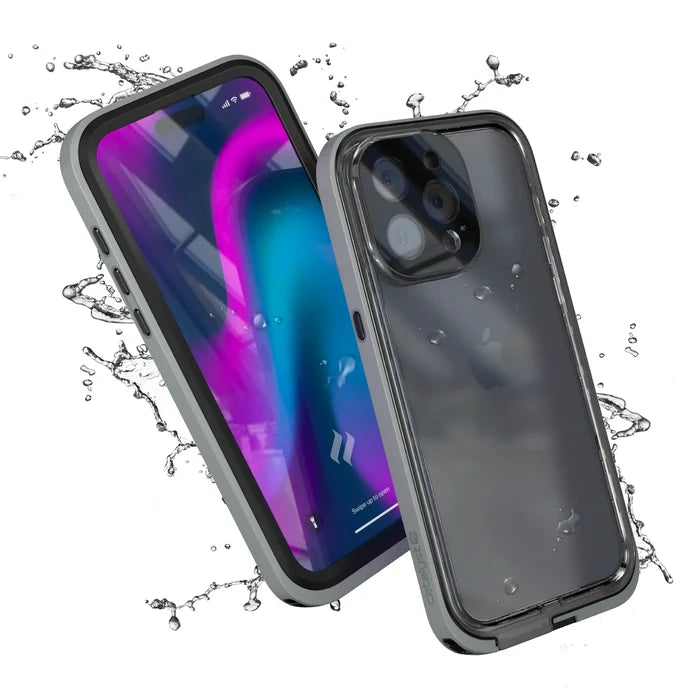 Two iPhone 15 Pro Max phones with Catalyst Case US Titanium Gray waterproof cases are shownÃƒÂ¢Ã¢â€šÂ¬Ã¢â‚¬Âone displays a vibrant screen, the other the back with water dropletsÃƒÂ¢Ã¢â€šÂ¬Ã¢â‚¬Âboth surrounded by splashing water, highlighting total drop proof protection and full functionality.