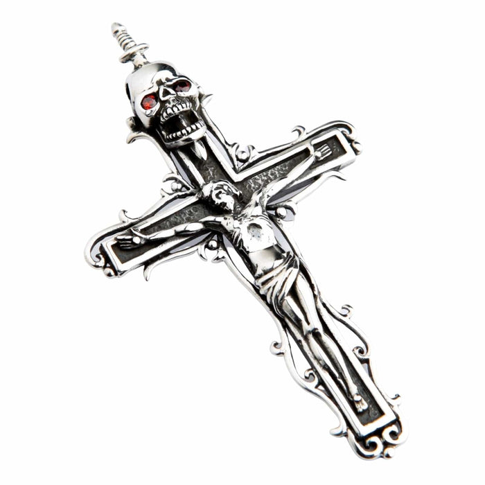 Angled silver crucifix showcasing the dagger-pierced skull with red garnet eyes positioned above the figure of Jesus.
