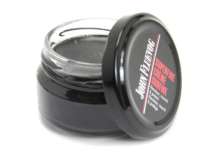 black - A jar of Fluevog leather conditioner in the colour black