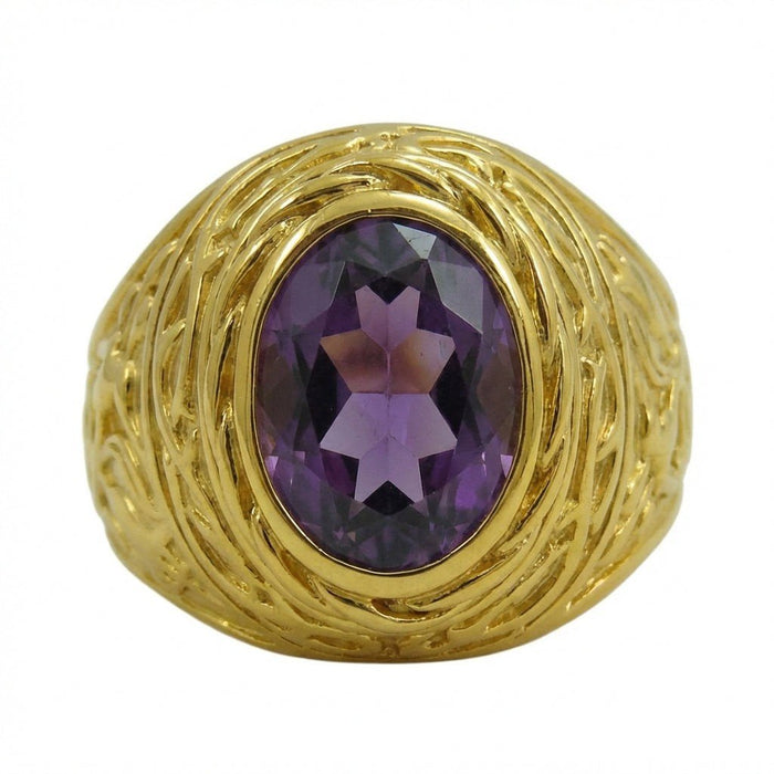 Direct overhead view highlighting the faceted purple amethyst center stone and surrounding curled gold petal texture.
