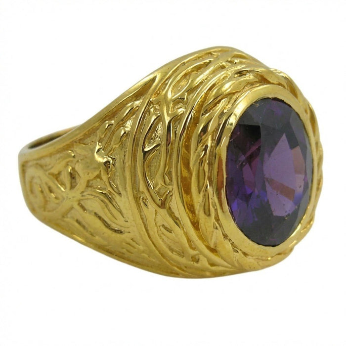 Angled side view highlighting the raised lily petal texture on the heavy gold band leading to the oval amethyst bezel.