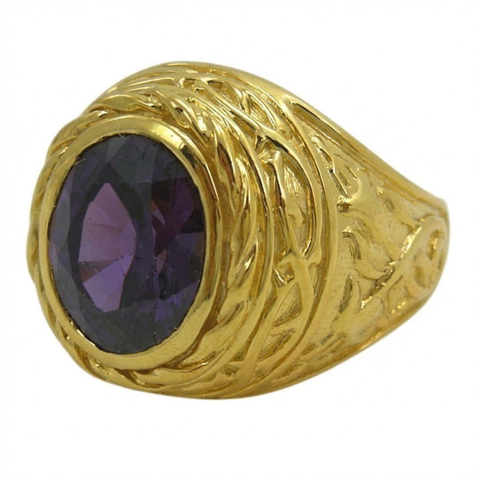 Close-up detailing the intertwined gold lily petals that form a thick, textured bezel around the faceted oval amethyst.