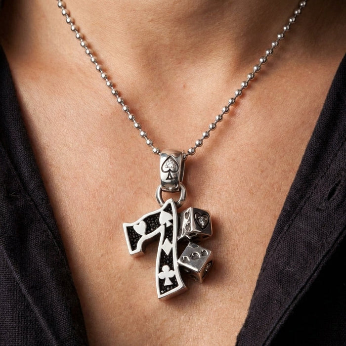 Lucky 7 gambler pendant worn on man's neck with silver ball chain showing scale and styling