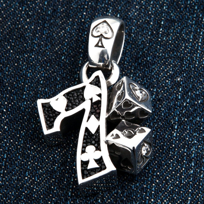 Lucky 7 dice sterling silver pendant front view showing card suit cutouts and CZ accents on denim background