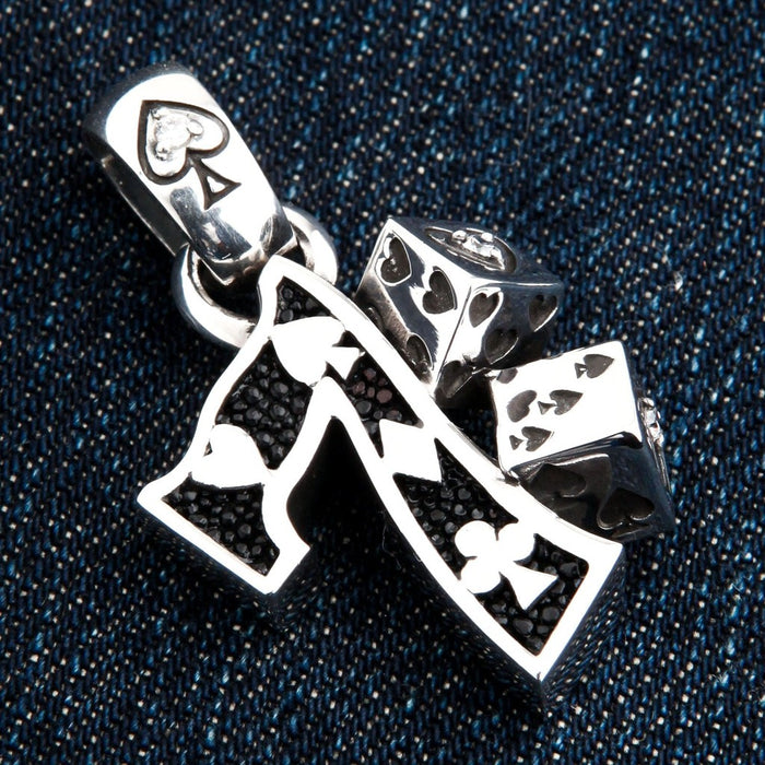 Sterling silver dice pendant angled view highlighting 3D dice with heart symbols and textured inlay