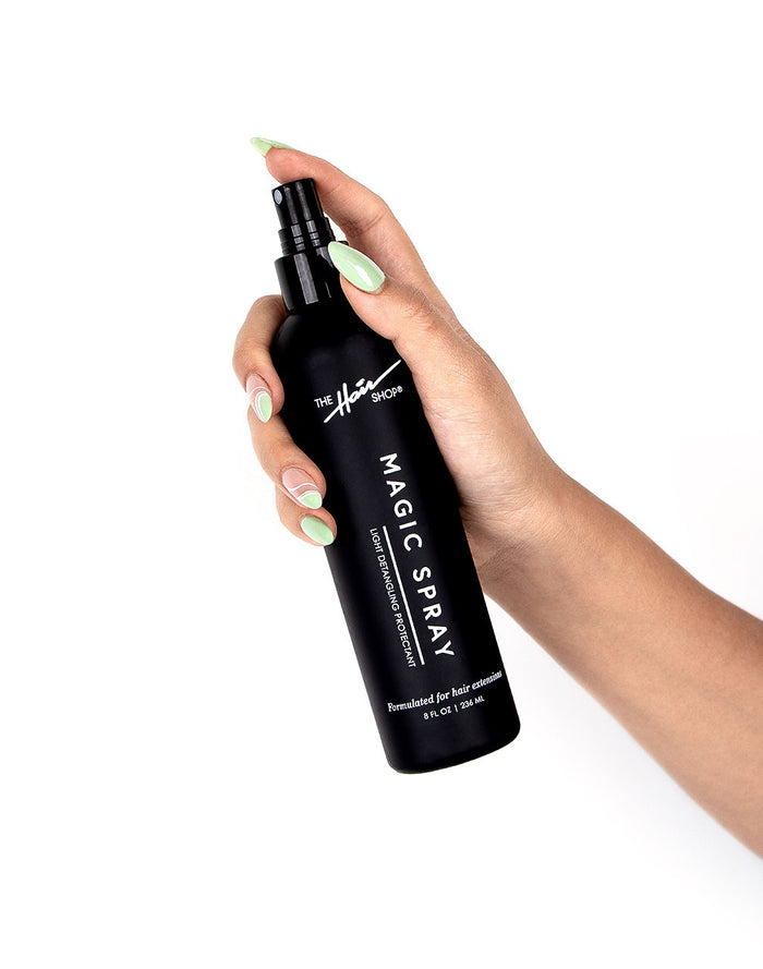 hand holidng the Magic Spray