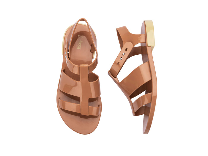 Melissa Blend Flat Strappy Brown Sandal styled for casual summer looks, offering comfort and sophistication in brown