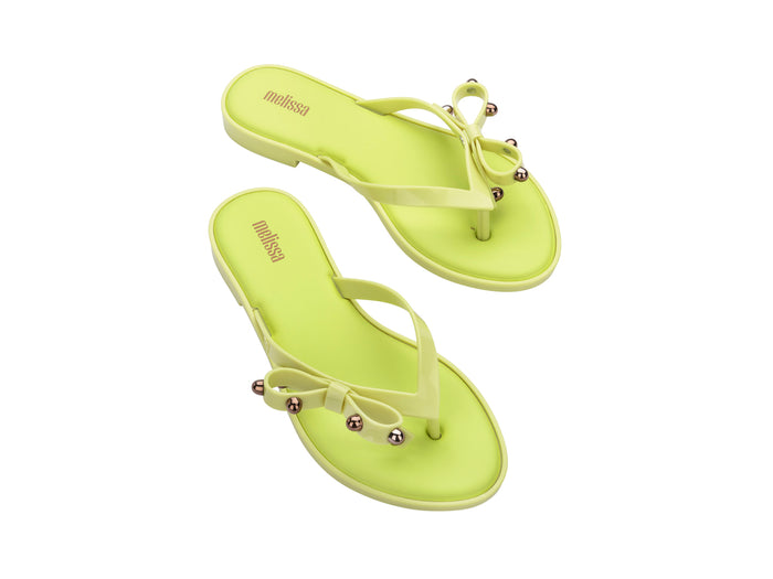 Melissa Flip Flop Slim II Bow Detail Yellow Beachwear Slipper for Women â€“ Trendy and comfortable slim flip-flops with a stylish bow design, perfect for beach outings and casual wear.