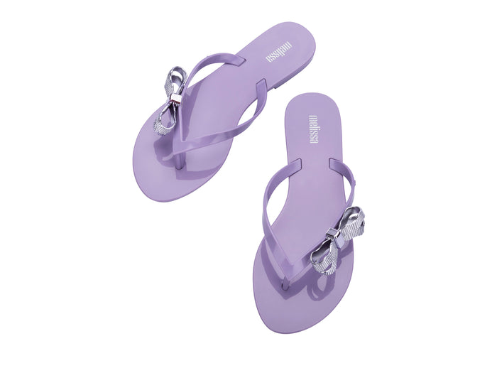 Melissa Harmonic Sweet V Flat Flip Flops Lilac Slippers for Women â€“ Stylish and comfortable flat flip-flops with a chic bow detail, perfect for casual and everyday wear.