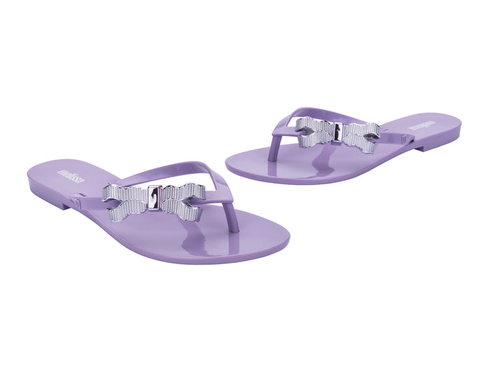 Melissa Harmonic Sweet V Flat Flip Flops Lilac Slippers for Women â€“ Stylish and comfortable flat flip-flops with a chic bow detail, perfect for casual and everyday wear.