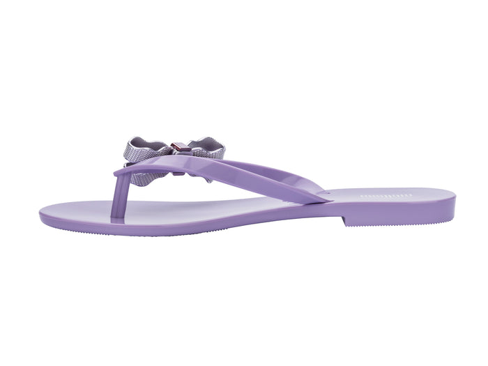Melissa Harmonic Sweet V Flat Flip Flops Lilac Slippers for Women â€“ Stylish and comfortable flat flip-flops with a chic bow detail, perfect for casual and everyday wear.