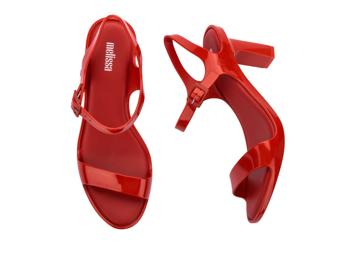 Melissa Lady Emme Buckle Closure Solid Red Sandal for Women – Elegant and stylish high-heeled sandal with a secure buckle closure, perfect for a chic and sophisticated look.