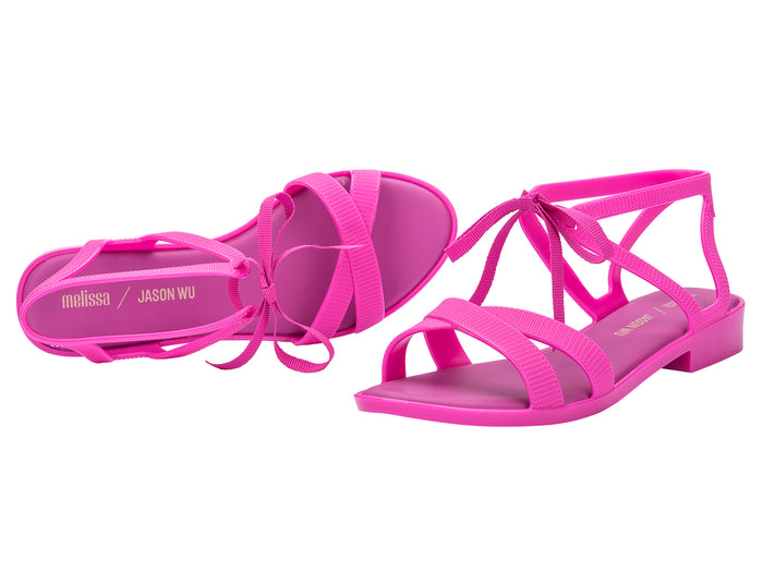 Melissa Ophelia Low X Jason Wu AD Strappy Fuchsia Sandal for Women â€“ Trendy and vibrant low-heel sandal with a strappy design, ideal for adding a pop of color to any outfit.