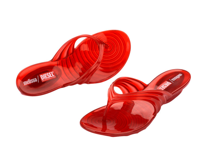 Melissa Quantum Thong Diesel trendy red flip flops for women featuring a stylish design and comfortable everyday wear.