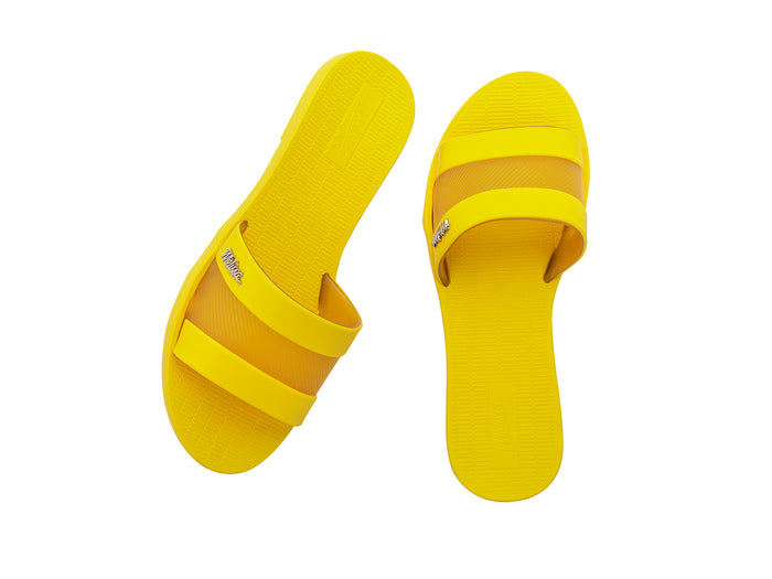 Melissa Sun Gaspea Ou Tiras yellow slides for women – trendy slip-on vegan sandals in bright summer style, crafted from Melflex for comfort and durability.