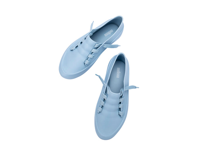 Melissa Ulitsa casual wear blue unisex sneaker featuring a sleek, comfortable design suitable for everyday wear by both men and women.