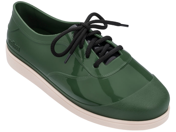 Unisex Melissa Line solid green lace-up sneakers featuring a sleek design and comfortable fit for both men and women