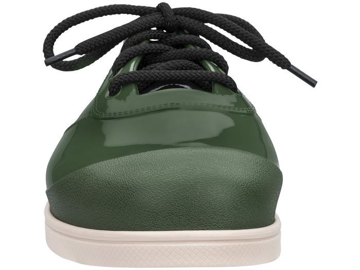 Unisex Melissa Line solid green lace-up sneakers featuring a sleek design and comfortable fit for both men and women