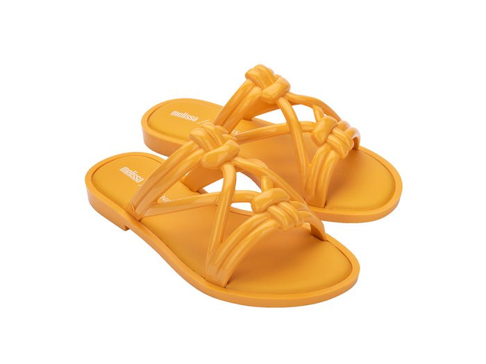 Melissa Wave Sand Salinas strappy yellow slip-on slides for women featuring a bold design, comfortable fit, and perfect for stylish beachwear.