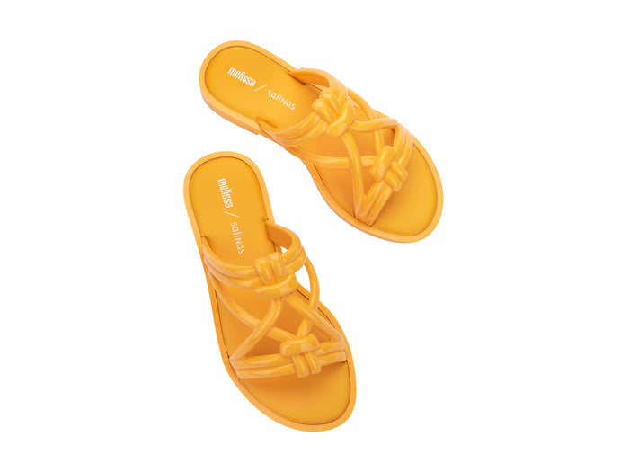 Melissa Wave Sand Salinas strappy yellow slip-on slides for women featuring a bold design, comfortable fit, and perfect for stylish beachwear.